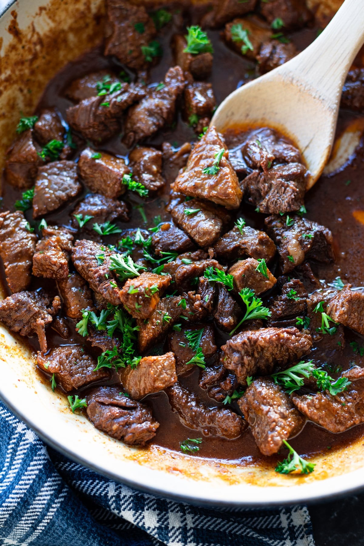 Close up of a skillet filled with steak bites and sauce.