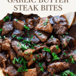 Steak bites in a skillet being served.