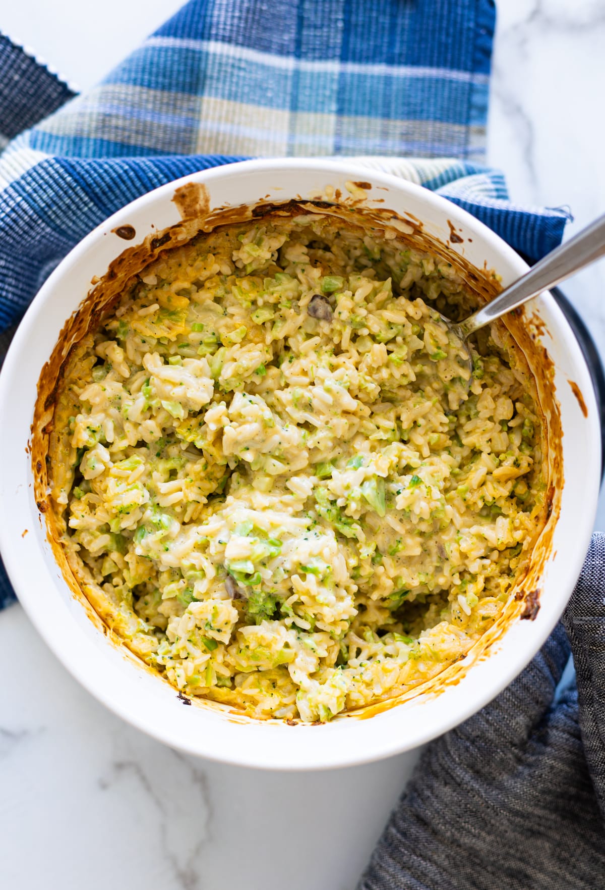 Casserole dish filled with cooked broccoli and rice casserole.