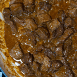 Skillet searing steak bites and sauce.